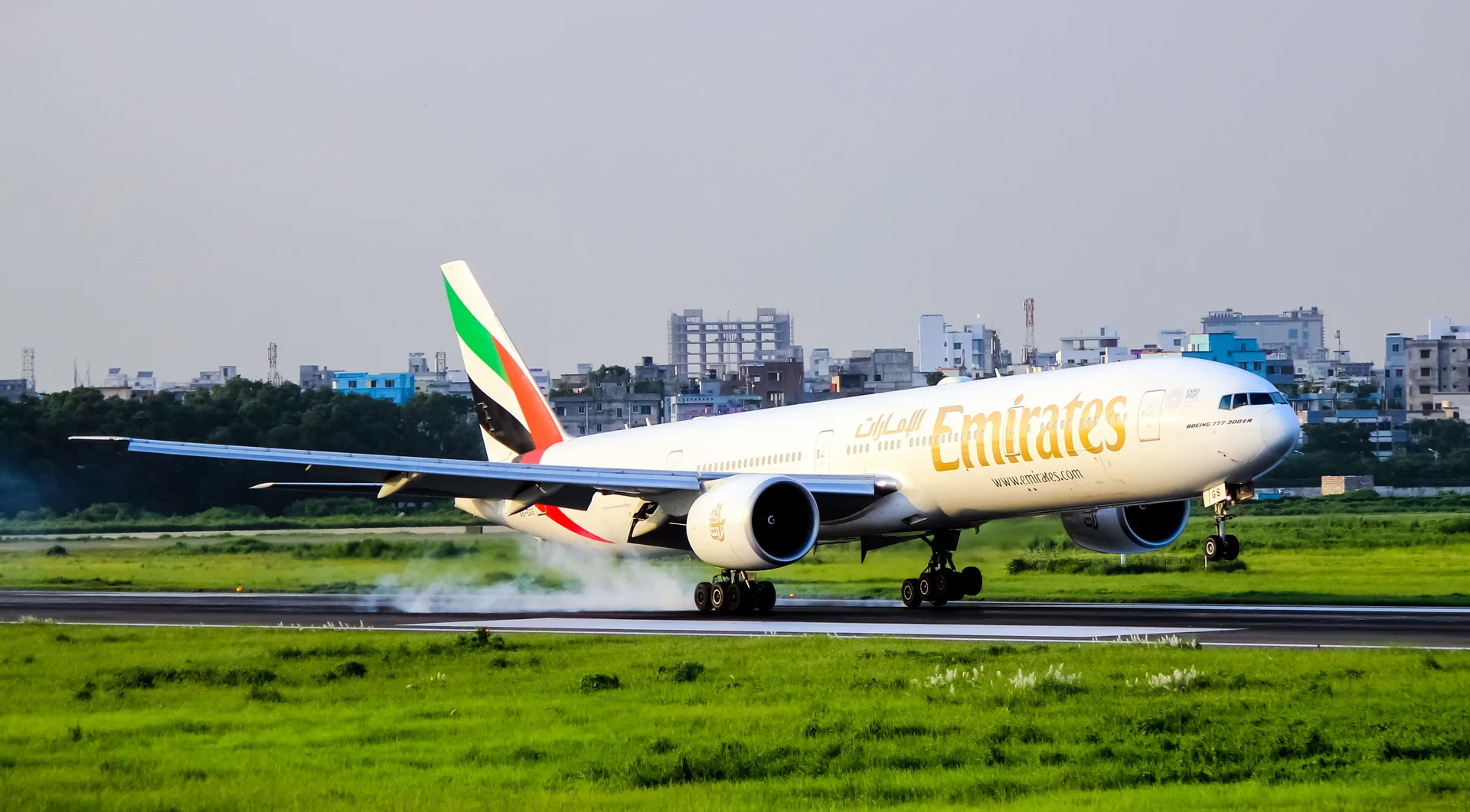 Emirates Boeing 777-300ER A6-EGS touching down on the runway