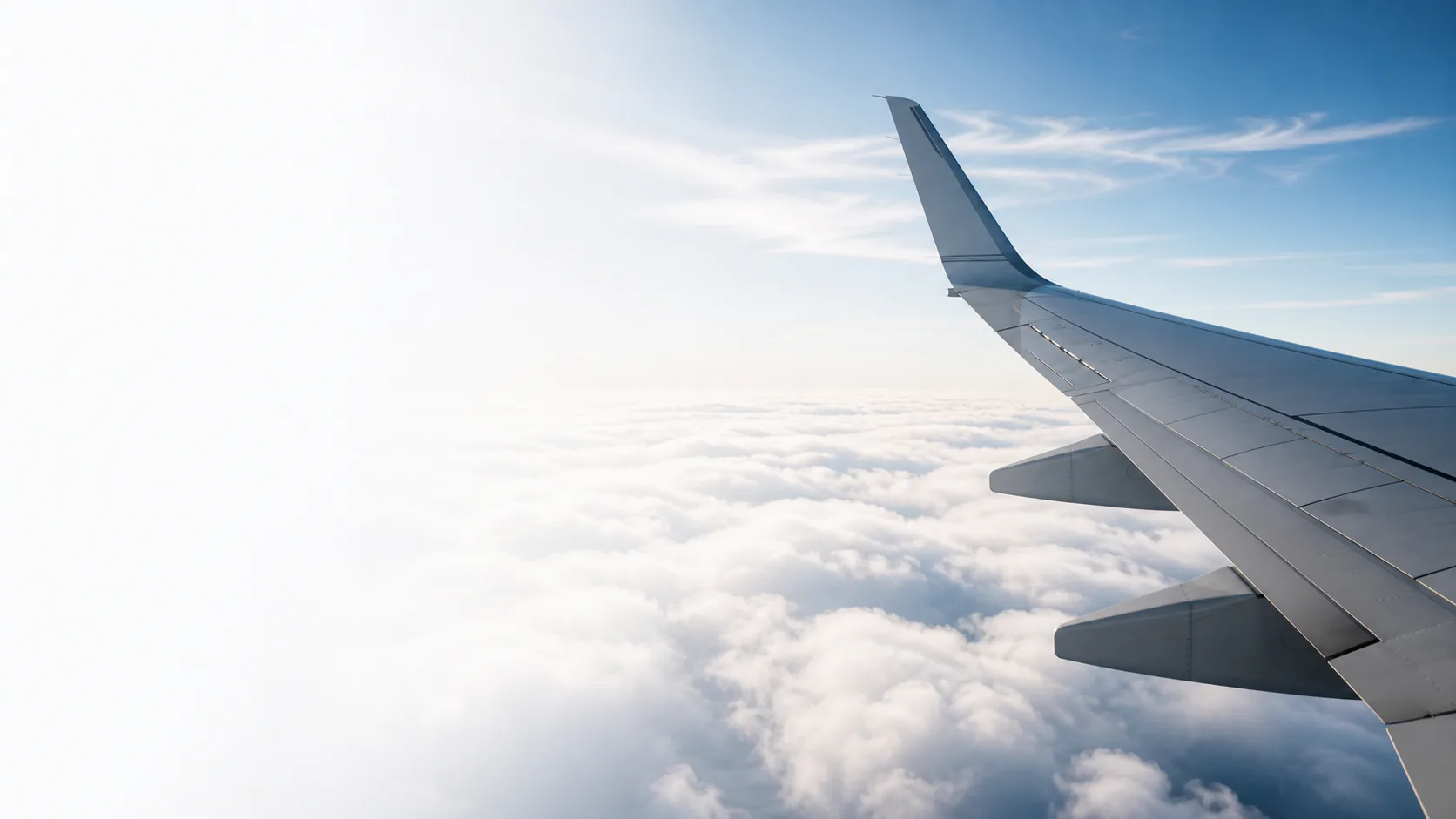 Aircraft wing above the clouds